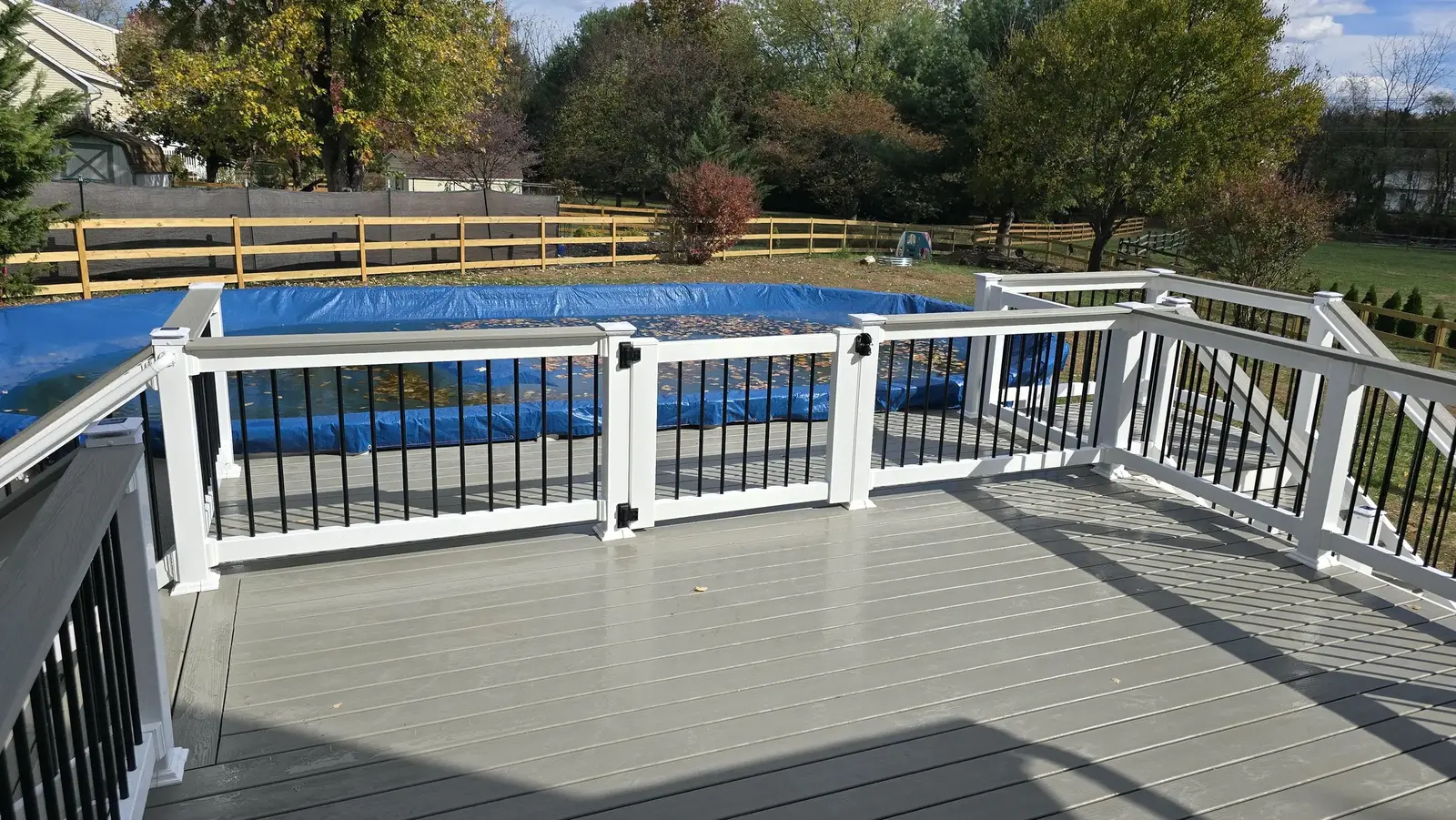 Finished composite pool deck built by Darling Builders in Maryland