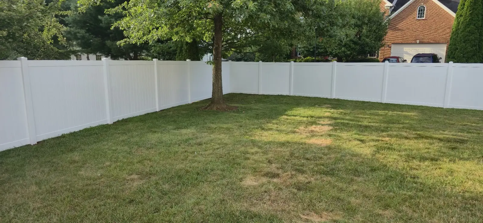 White vinyl privacy fence enclosing a Maryland backyard